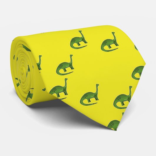 Cravate Dinosaures verts sur motif jaune (Roulé)