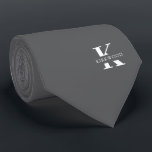 Cravate Monogramme Élégant Gris | Blanc<br><div class="desc">Une cravate élégante présentant un monogramme blanc gras sur un fond gris argent. Au-dessus de ce monogramme figure votre prénom ou nom de famille écrit en majuscules.</div>