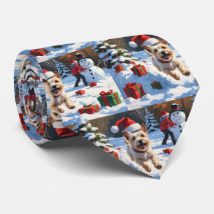 Cravate Terrier Cairn courant dans la neige avec un chapea