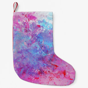 Creatieve roze-blauwe textuur, verfvlekken. kleine kerstsok