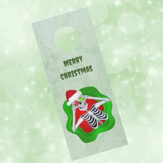 Creepy Christmas Skeleton in Splatter Ornament Eye (Creepy Christmas skeleton ornament eyes in splatter shape on green paper door knob hanger.)