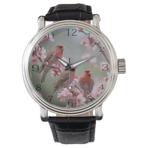 Crimson Trio: Red Finches te midden van roze bloem Horloge