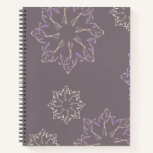 Cuaderno de espiral con diseño de plantas.