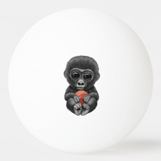 Cute Baby Gorilla die met Basketball speelt Pingpongballen