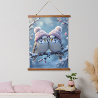 Cute budgies with bobble hats on a branch hangend wandkleed