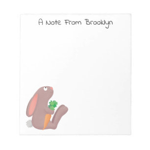Cute bunny rabbit, zittend met wortelcartoon notitieblok