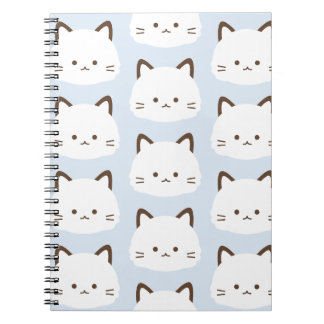 Cute face kat met pastelblauwe achtergrond notitieboek
