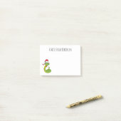 Cute green slang met santa hat cartoon post-it® notes (Op bureau)