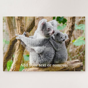 Cute koala beer and baby sit on eucalypyus tree, legpuzzel
