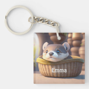 Cute otter baby in een mand - aanpasbaar sleutelhanger