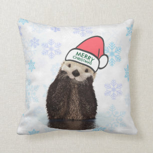 Cute Otter die een kerstman met kerstmis heeft. Kussen