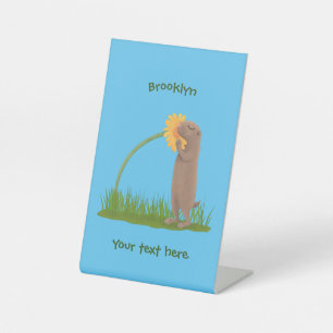 Cute prairie dog sniffing flower cartoon reclamebord met voetstuk