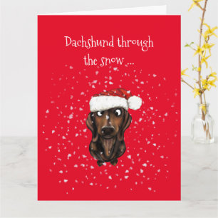 Dachshund à travers la neige ... Carte de Noël