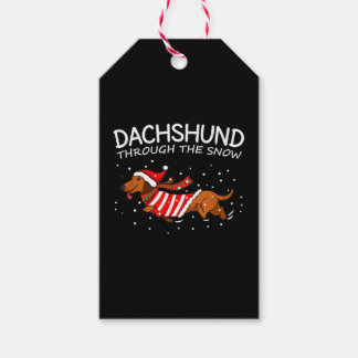 Dachshund door de sneeuwnende hond kerstmis cadeaulabel