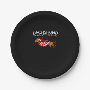 Dachshund door de sneeuwvloed met kerstmis papieren bordje