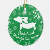 Dachshund door het Ornament van de sneeuwkerstboom (Links)