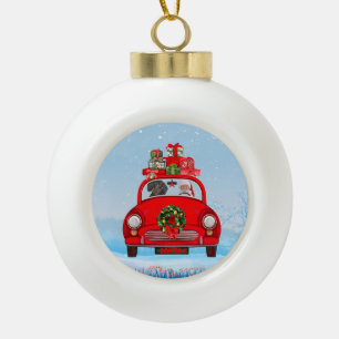 Dachshund-hond in auto met kerstman keramische bal ornament