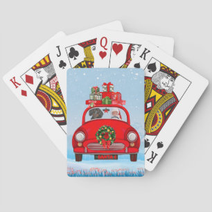 Dachshund-hond in auto met kerstman pokerkaarten