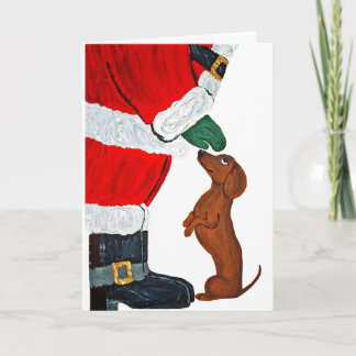 Dachshund krijgt een huisdier van de Kerstman