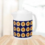 Dahlia jaune motif floral sur bleu<br><div class="desc">Théière en céramique blanche avec couvercle qui présente l'image d'une fleur Dahlia jaune sur un arrière - plan bleu marine et imprimé dans un motif extensible. Un design floral et amusant !</div>