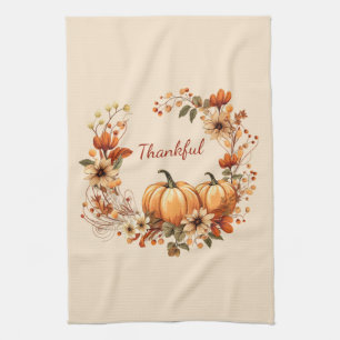 Dankbare pompoen en herfstbloemen krans theedoek