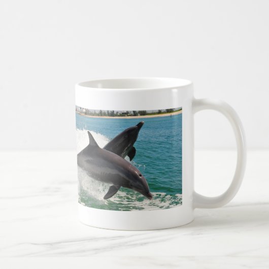 Dauphins de Bottlenose sauvages sautant la tasse (Droite)
