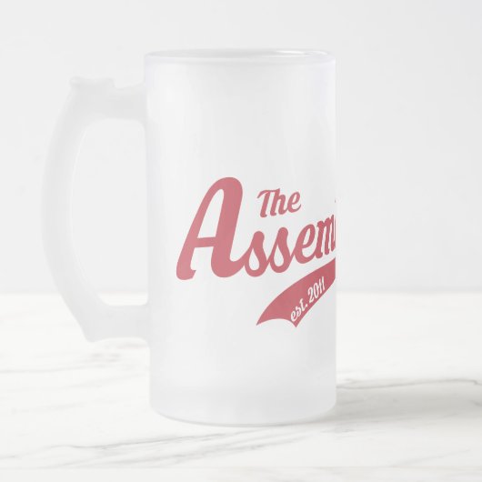 De bevuilde Mok van de Glas met de logo van de de (Links)
