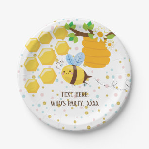 de bij, honingsbij, honingskam, stuntelt bij papieren bordje