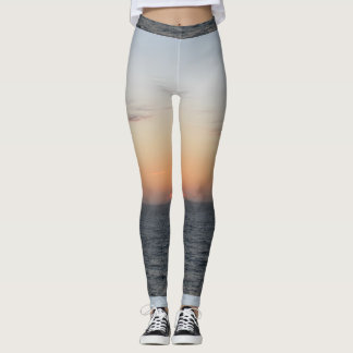 De gloeiende Oranje Leggings van de Zonsondergang