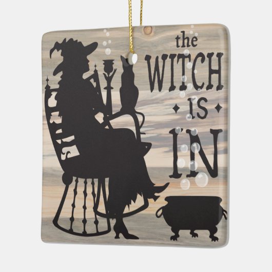 De heks is omkeerbaar in/uit-teken keramisch ornament (Links)