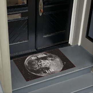 De heks zit in deurmat