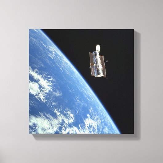 De Hubble Ruimtetelescoop met een blauwe aarde Canvas Afdruk (Voorkant)