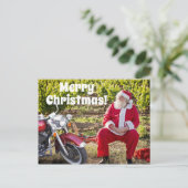 De kerstman rust met zijn kerst op de motorfiets briefkaart (Staand voorkant)