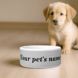 De naam van uw hond met grijze achtergrond op de v voerbakje