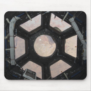 De Sahara is zichtbaar door de ramen Muismat