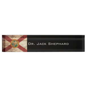 De vlag van Florida op de oude houten graan Naambordje