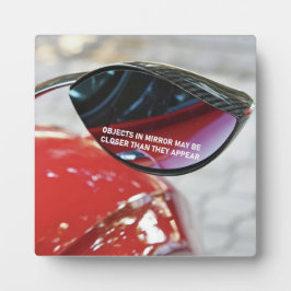De voorwerpen van het Effect Mandela in spiegel ku Fotoplaat
