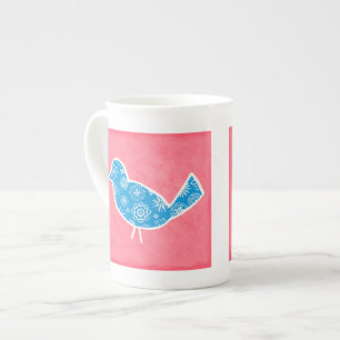 Decoratieve vogel met patronen op roze achtergrond porselein kop