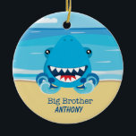 Décoration En Céramique Big Brother Shark On Beach Orament<br><div class="desc">Quelque chose de spécial pour le Big Brother !Il y a une scène de plage avec l'océan. Dans l'océan, il y a un requin. Sa bouche est ouverte et montre ses grandes dents acérées. Sur le sable de la plage, il y a "Big Brother". Personnalisez-le pour le rendre spécial avec...</div>