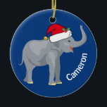 Décoration En Céramique Blue Elephant mignon Monogramme Noël<br><div class="desc">Les mignons animaux de vacances sont ma partie préférée de Noël. Un bel éléphant bleu portant un chapeau de Père Noël rouge et qui a l'air heureux. Ce joli ornement monogrammé me remplit de l'esprit de Noël.</div>