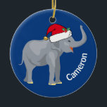 Décoration En Céramique Blue Elephant mignon Monogramme Noël<br><div class="desc">Les mignons animaux de vacances sont ma partie préférée de Noël. Un bel éléphant bleu portant un chapeau de Père Noël rouge et qui a l'air heureux. Ce joli ornement monogrammé me remplit de l'esprit de Noël.</div>