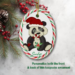 Décoration En Céramique Cadre Sucre de canne Ours Panda Cute<br><div class="desc">Voici un joli ornement de Noël pour tout petit-enfant qui aime les ours de panda. Un panda noir et blanc aux yeux larges tient un sucre de canne et porte un chapeau de Père Noël. En dessous de l'image est le nom de votre enfant spécial en vert. L'image est encadrée...</div>