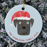 Décoration En Céramique Chien de Noël Nom de famille Date<br><div class="desc">Mignonne et adorable chien noir dans un chapeau de Noël rouge. Modifiez le nom de famille,  la date et le texte pour personnaliser. Art original de Nic Squirrell.</div>