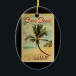 Décoration En Céramique Cocoa Beach Palm Tree Vintage voyage<br><div class="desc">Un design moderne unique rétro du milieu du siècle Cocoa Beach Floride imprimé d'art dans le style d'affiche de voyage vintage. Il dispose d'un palmier incurvé sur une plage de sable avec l'océan sous un ciel bleu nuageux.</div>