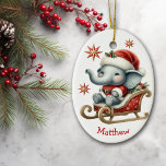 Décoration En Céramique Joli Père Noël Elephant Sleigh Enfants Noël<br><div class="desc">Sur le devant de ce joli ornement de Noël pour enfants est un adorable petit ours panda assis dans un traîneau rouge et or. Il porte un chapeau de Père Noël rouge et blanc et un costume père Noël. Des étoiles décoratives rouges et dorées sont éparpillées, et votre nom personnalisé...</div>