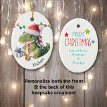 Décoration En Céramique Joyeux Noël Dinosaur<br><div class="desc">Sur le devant de cet ornement en céramique de conservation pour un enfant est un adorable bébé dinosaure portant un chapeau de Père Noël. Il a une ampoule d'arbre de Noël entre ses pieds, et un paquet cadeau à côté de lui. Il y a une série de lumières de Holiday...</div>