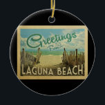 Décoration En Céramique Laguna Beach Vintage voyage<br><div class="desc">Ce design de carte postale vintage de Greutas From Laguna Beach dispose d'une plage de sable avec une belle eau turquoise de l'océan et au-dessus de la mer,  un ciel bleu avec des nuages blancs lustrés. Dans un style de voyage vintage.</div>