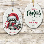 Décoration En Céramique Noël du cousin de Santa Hat<br><div class="desc">Sur le devant de ce joli ornement de Noël pour enfants est un adorable petit raton laveur tenant un sucre de canne. Il porte un chapeau et une écharpe de Père Noël rouge et blanc. Quelques flocons d'argent sont éparpillés, et votre nom personnalisé est au fond. Le dos de l'ornement...</div>