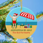 Décoration En Céramique Noël en juillet Été Santa Claus Cute Beach<br><div class="desc">Ce joli Noël personnalisé en Juillet ornement fait un cadeau parfait pour une fête d'été pour un bain de plage ou de la piscine. Faites-en une extravagance amusante sur le thème du pôle nord avec le Père Noël dans ses maillots de bain à côté d'un parapluie de plage rayé rouge...</div>