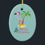 Décoration En Céramique Pink Flamingo In A Santa Hat Cute<br><div class="desc">A Christmas ornament with a tropical island flair. A cute illustration of a pink flamingo in a red Santa hat. Standing beside a green palm tree on a mound of yellow sand. A fancy swirly Christmas tree design is placed beside the text Merry Christmas. Written in the color pink in...</div>